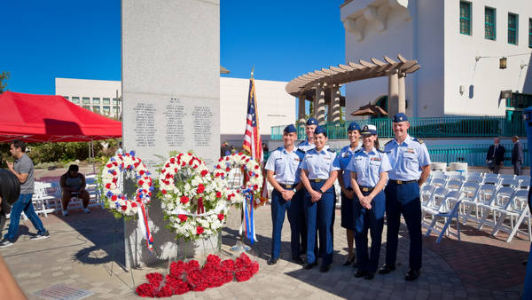 group of ROTC students next to a monument on SDSU campus