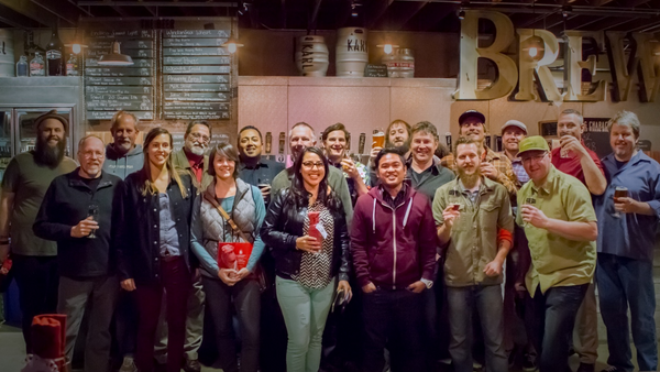 group of people at a brewery