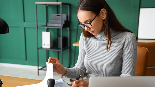 Woman working at desk. 