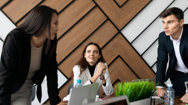 A group of regulatory affairs professionals conversing. 