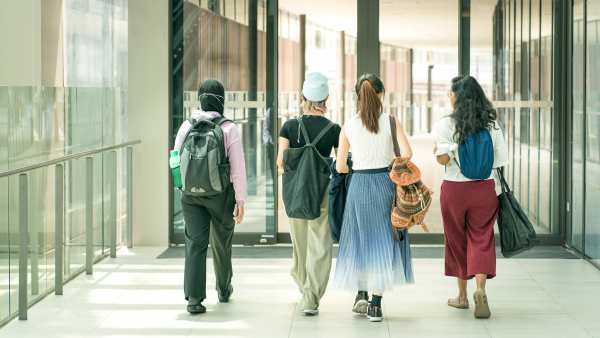 Four people walking. 