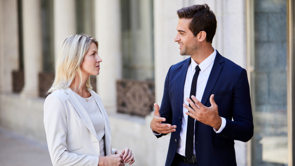 Two professionals talking to one another. 