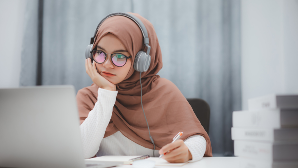 A woman studying on her computer. 