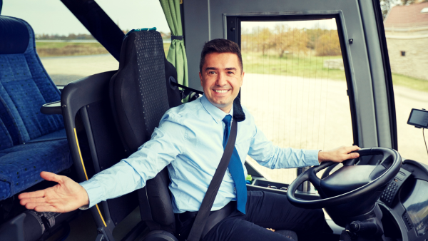 A bus driver opens their hand. 