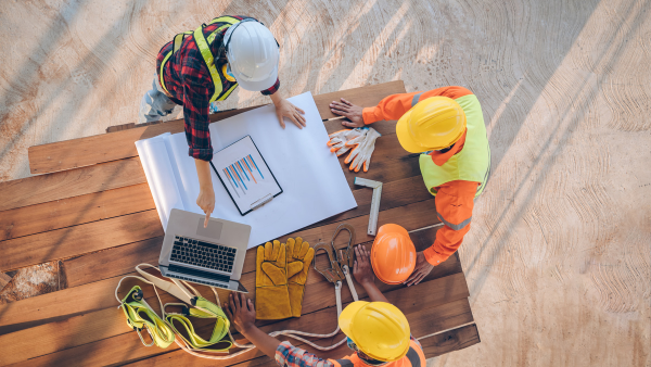 Three Construction workers planning